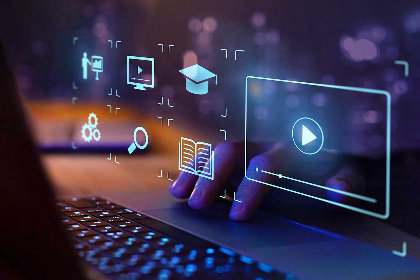 Laptop with glowing icons on a dark background