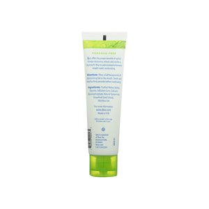Green and white tube of a toothpaste on a white background