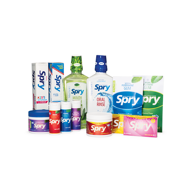 Collection of Spry dental products including mouthwash, gum, and other related items on a white background.